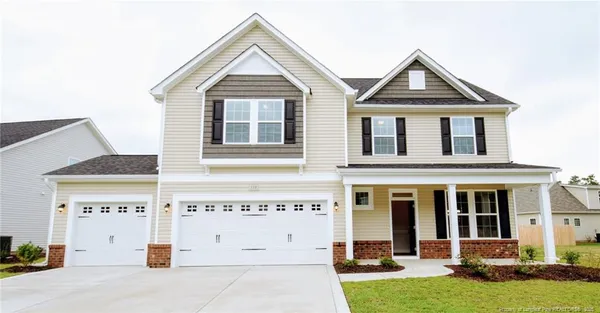 front view of a house with a yard