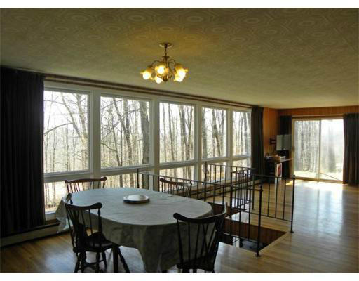 10 Willey Road Monroe, MA 01350 - Photo 8 of 18 a view of a dining room with furniture window and wooden floor