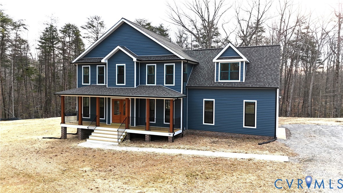 375 Amick Road Louisa, VA 23093 - Photo 1 of 25 a front view of a house with a yard covered in snow