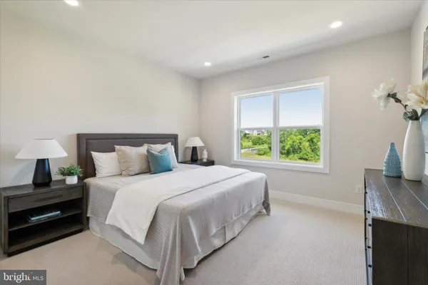 a bedroom with a bed and a tv