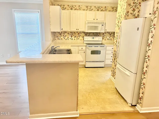 a view of a lake with a house in the background