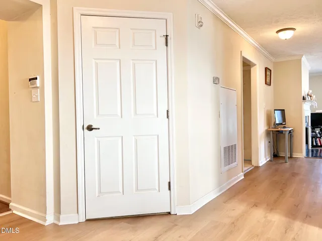 a view of a bedroom from a hallway