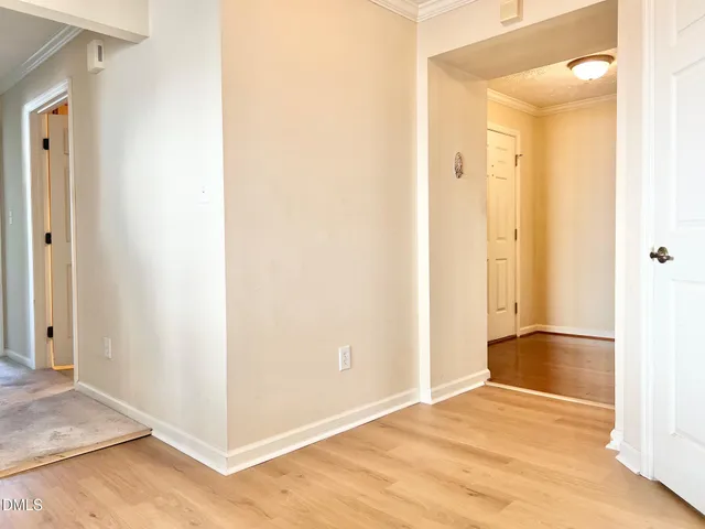 a kitchen with a refrigerator and a sink