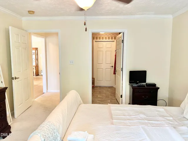 a en suite bathroom with a double vanity sink a mirror and a shower