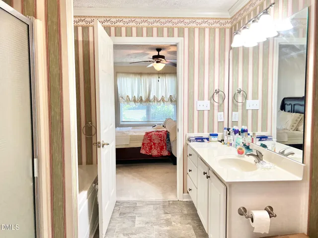 a bathroom with a bathtub and shower