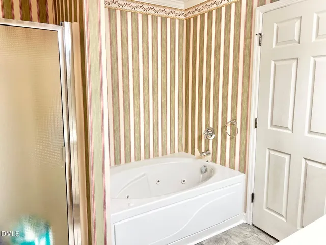 a bathroom with a sink vanity and a mirror