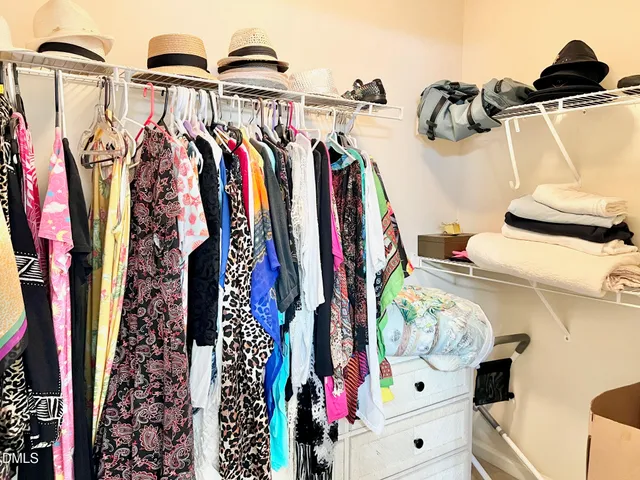 a view of a dining room with furniture and a window