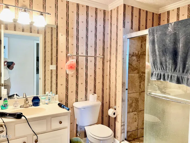 a view of front door and potted plants