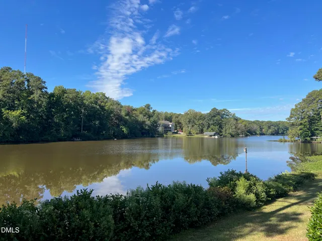 a view of lake with green space
