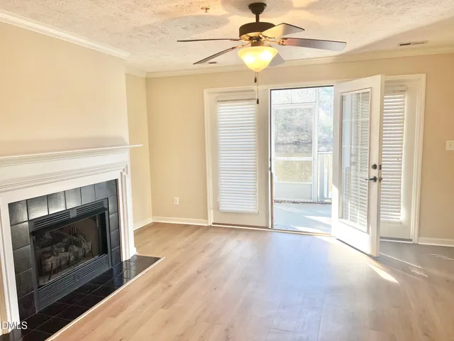 a view of a dining room with furniture and a chandelier