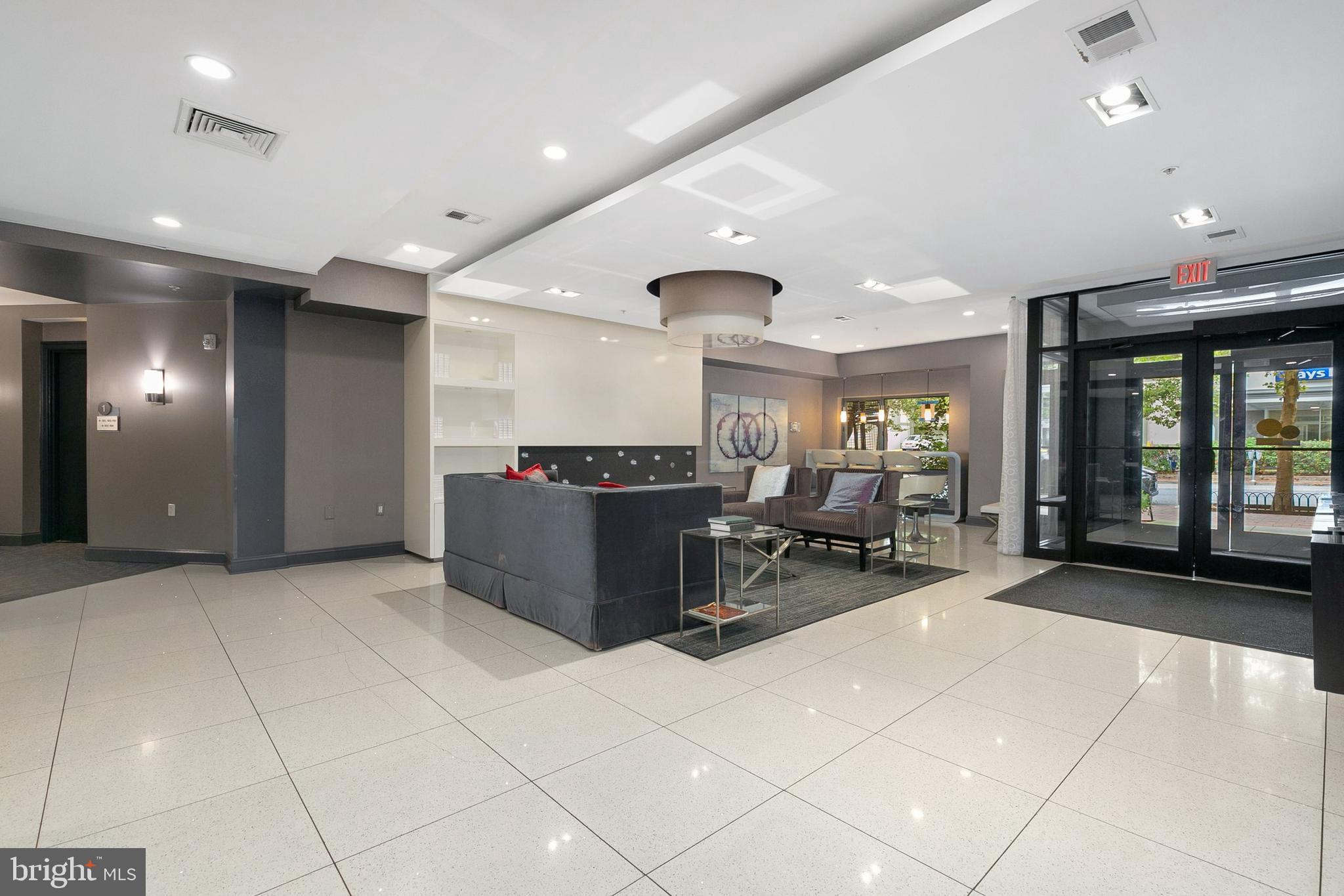 8005 13th Street, Unit 202 Silver Spring, MD 20910 - Photo 20 of 30 a lobby with furniture and large windows