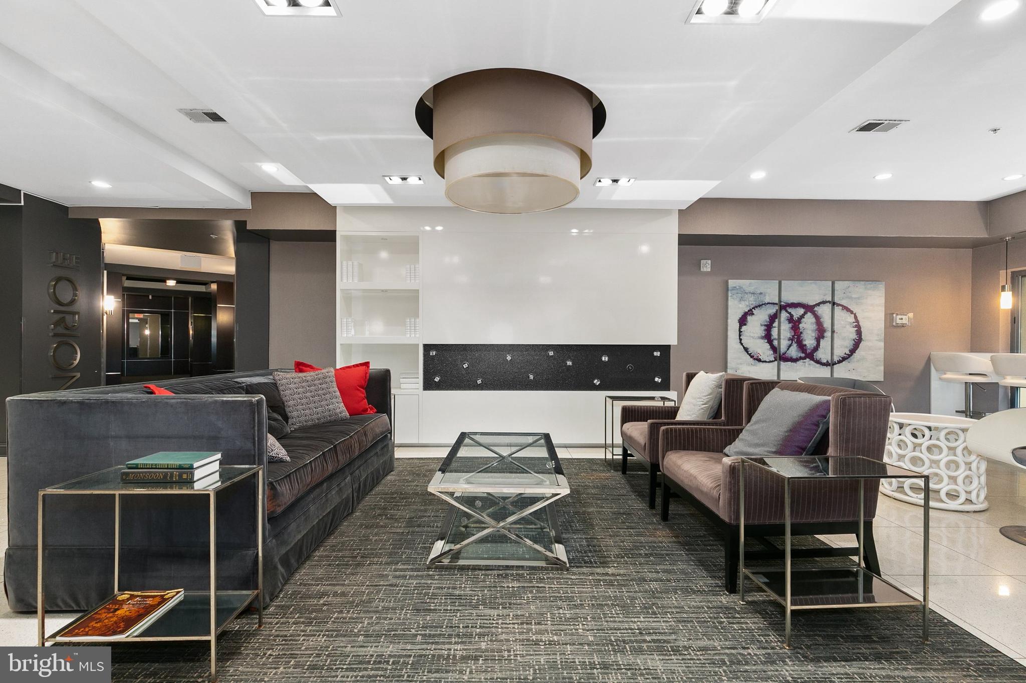 8005 13th Street, Unit 202 Silver Spring, MD 20910 - Photo 21 of 30 a living room with furniture and a mirror