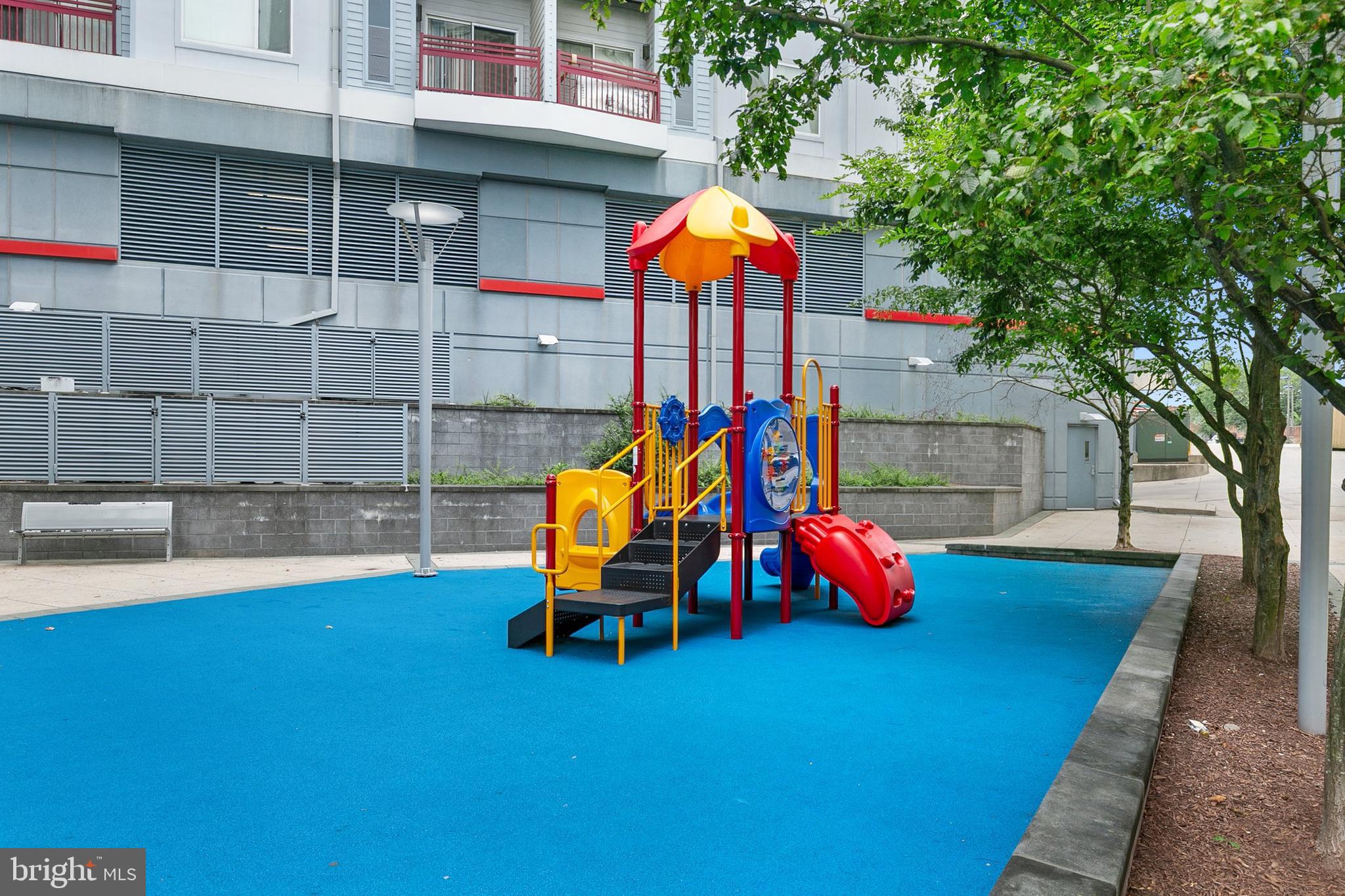 8005 13th Street, Unit 202 Silver Spring, MD 20910 - Photo 29 of 30 an outdoor sitting area with chairs and umbrellas