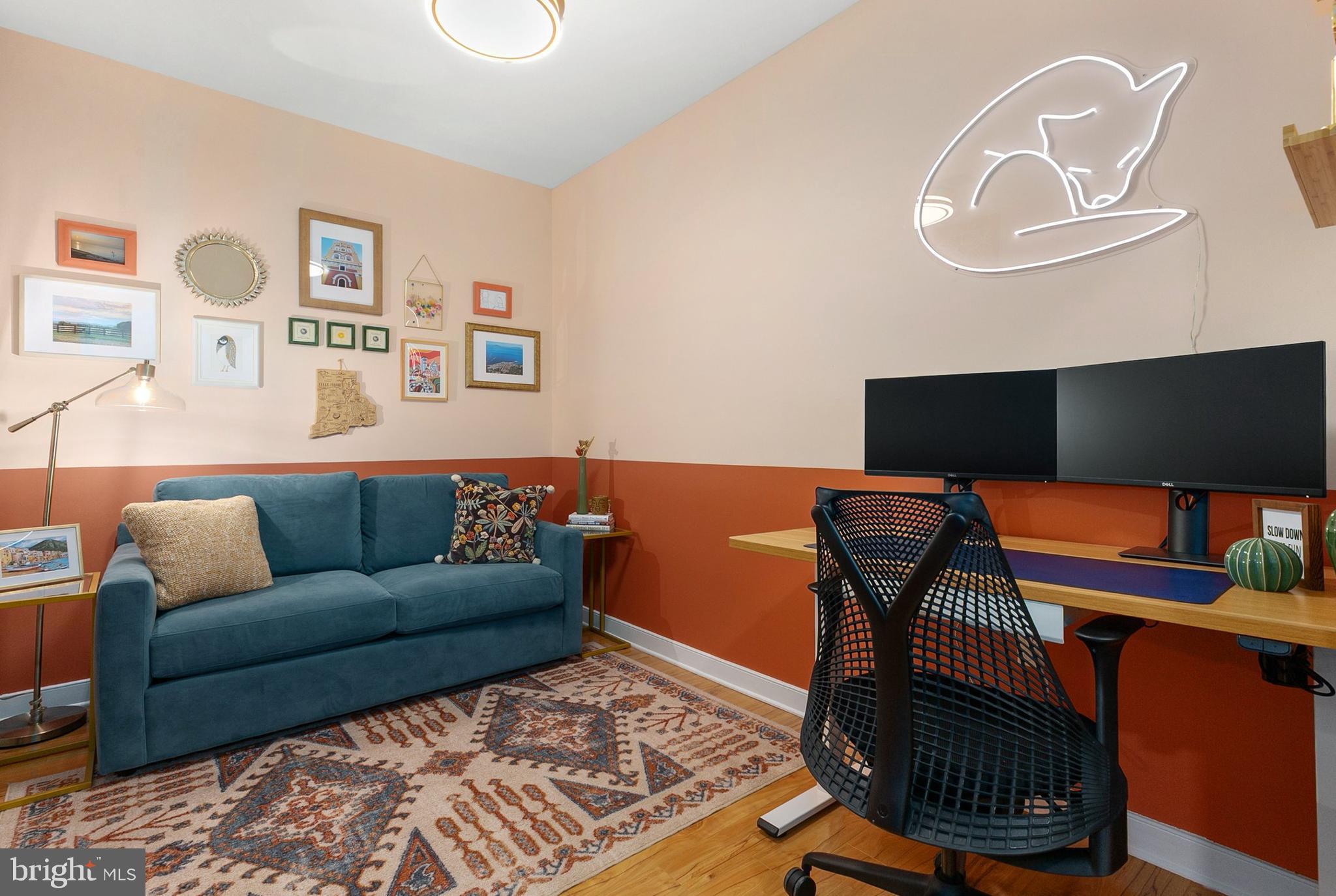 8005 13th Street, Unit 202 Silver Spring, MD 20910 - Photo 4 of 30 a living room with furniture and a wooden floor
