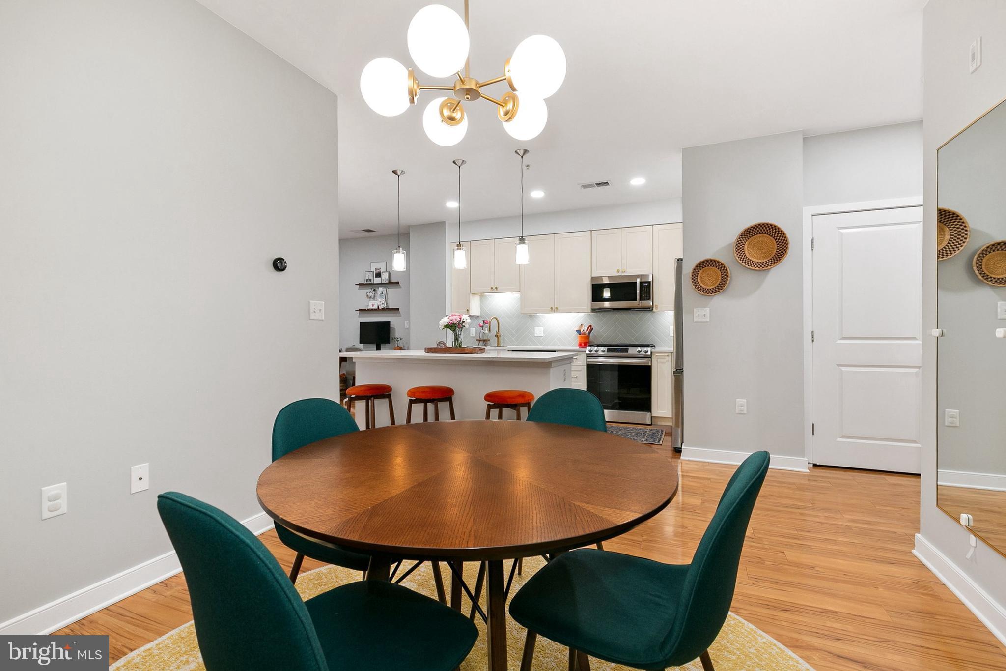 8005 13th Street, Unit 202 Silver Spring, MD 20910 - Photo 6 of 30 a dining room with furniture and window
