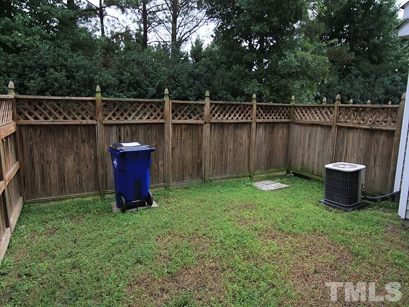 5349 Glen Canyon Road Raleigh, NC 27616 - Photo 13 of 14 a view of a backyard with wooden fence
