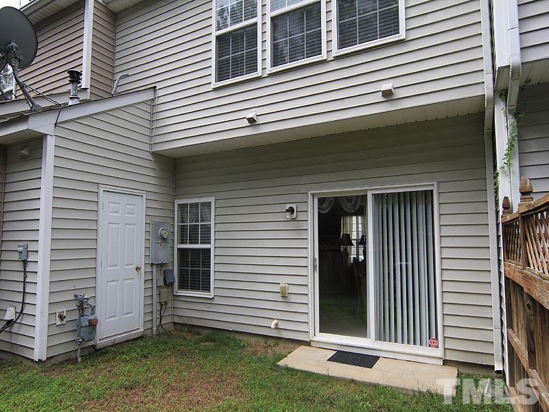 5349 Glen Canyon Road Raleigh, NC 27616 - Photo 14 of 14 a view of a house with a yard and a garage