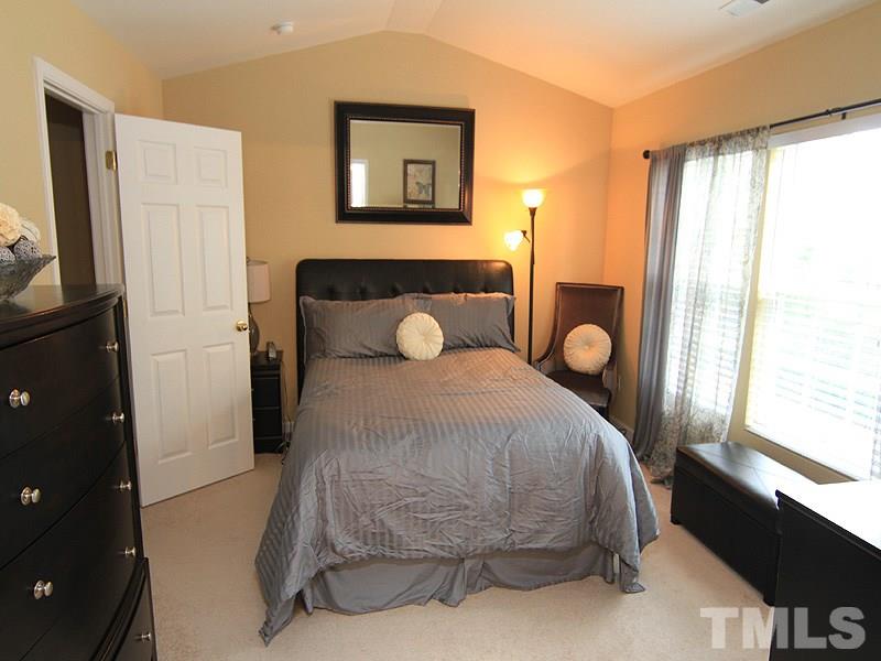 5349 Glen Canyon Road Raleigh, NC 27616 - Photo 8 of 14 a bedroom with a bed and a window