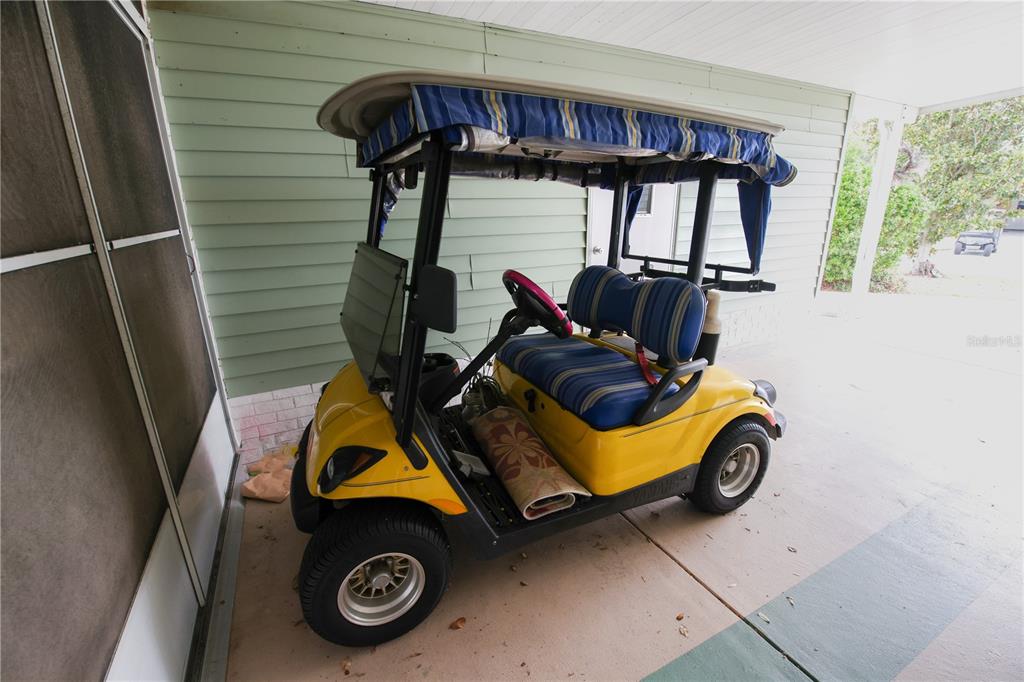 912 Orchid Street The Villages, FL 32159 - Photo 15 of 20 a car parked in front of a house