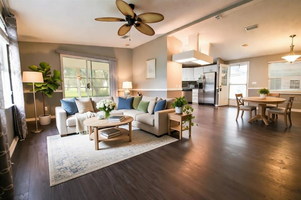 912 Orchid Street The Villages, FL 32159 - Photo 3 of 20 a living room with furniture and a large window