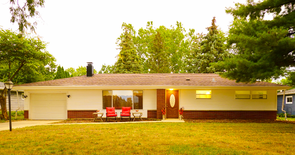 a view of a swimming pool with an outdoor space and seating area