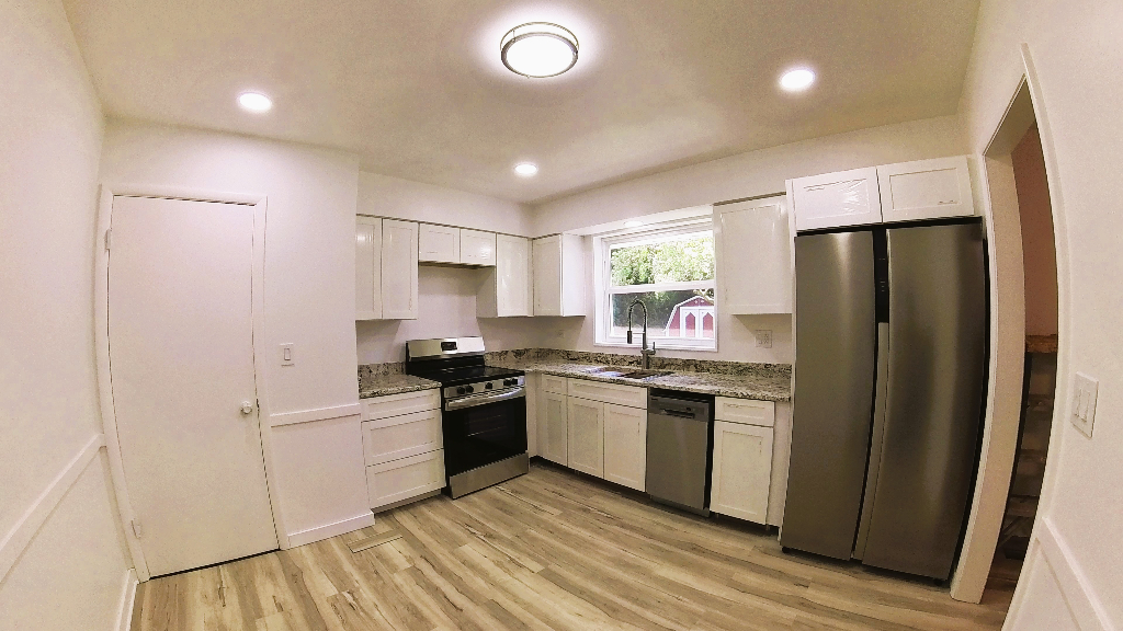 808 Bridle Lane Wheaton, IL 60187 - Photo 9 of 22 a kitchen with stainless steel appliances granite countertop a stove top oven a refrigerator a sink and dishwasher with wooden floor