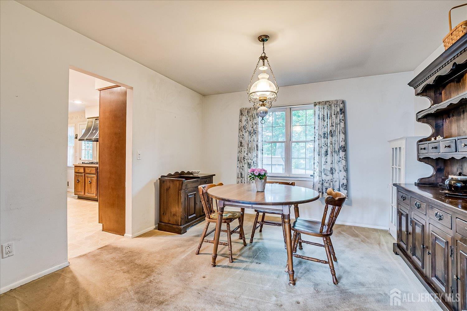 4 Bodnarik Road Edison, NJ 08837 - Photo 12 of 41 a view of a dining room with furniture and chandelier