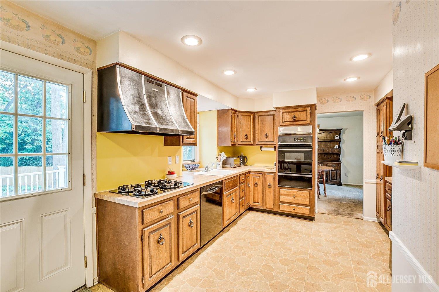 4 Bodnarik Road Edison, NJ 08837 - Photo 14 of 41 a kitchen with stainless steel appliances a stove and a refrigerator