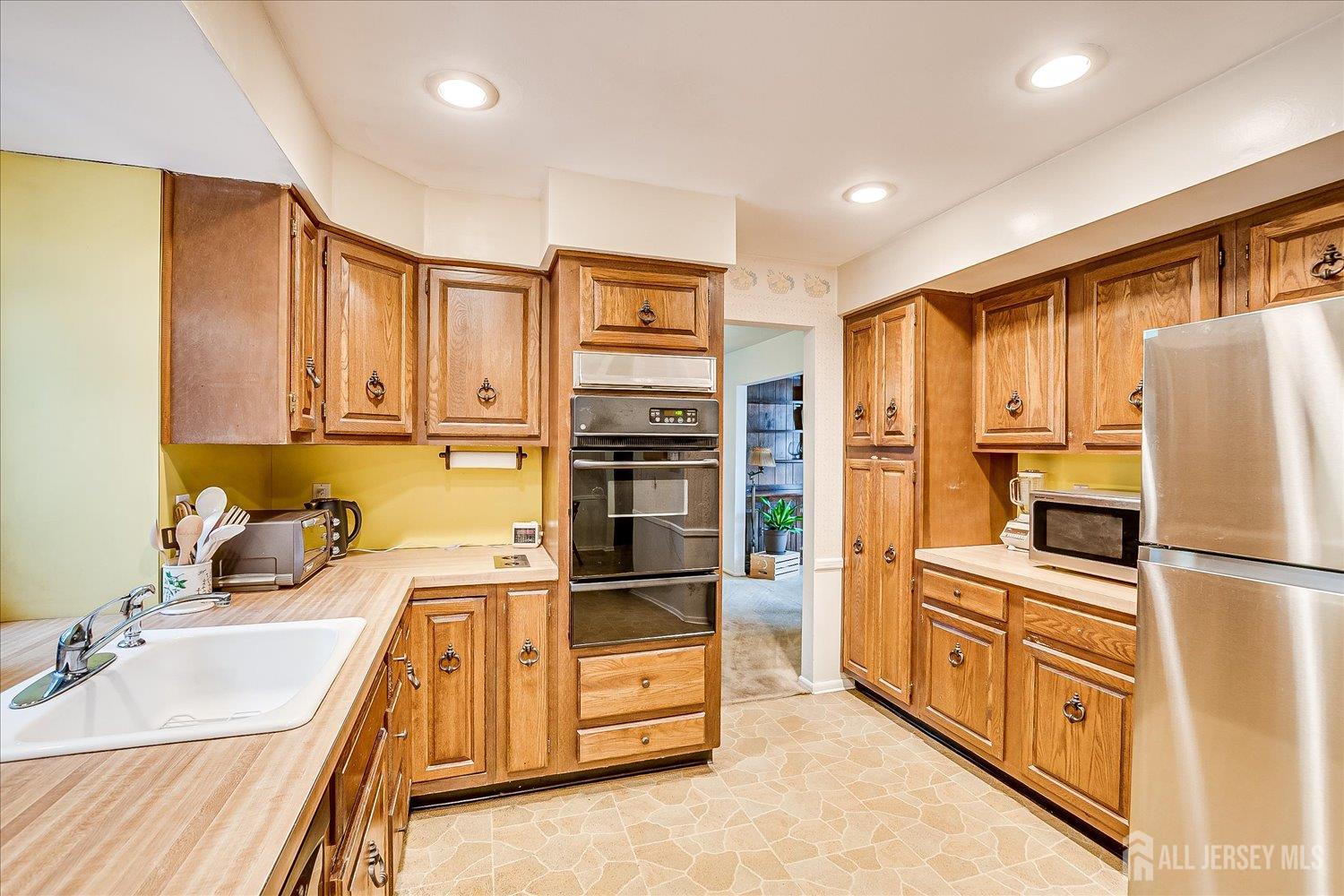 4 Bodnarik Road Edison, NJ 08837 - Photo 18 of 41 a kitchen with stainless steel appliances a refrigerator sink and cabinets