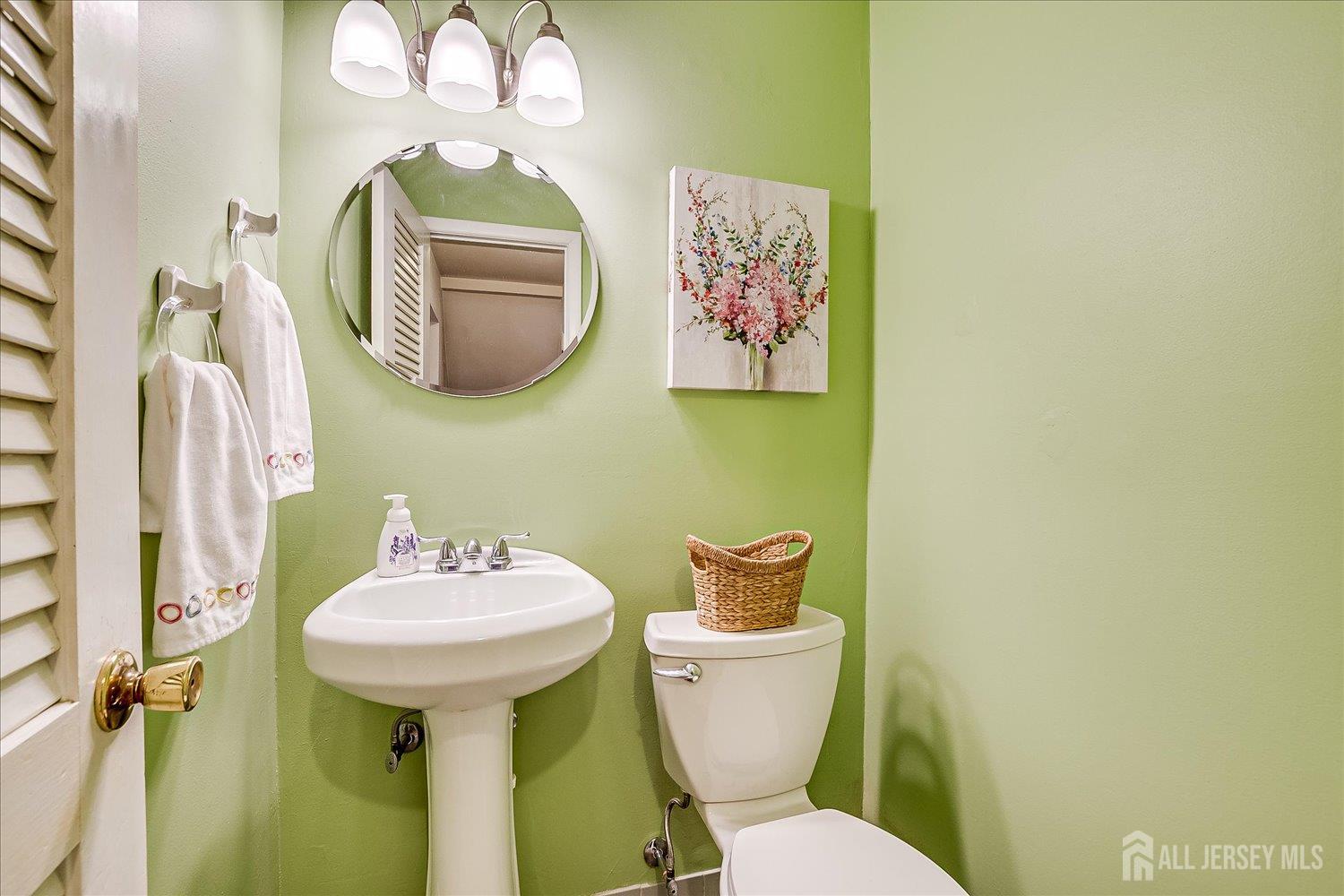 4 Bodnarik Road Edison, NJ 08837 - Photo 20 of 41 a bathroom with a toilet sink and mirror