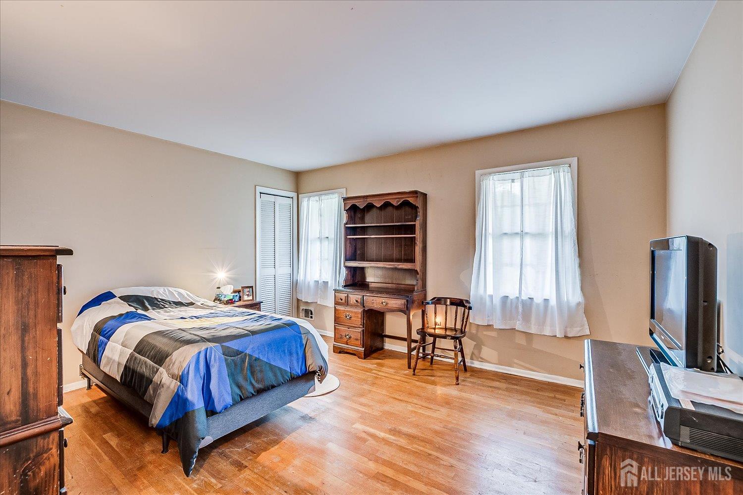 4 Bodnarik Road Edison, NJ 08837 - Photo 24 of 41 a bedroom with a bed and a flat screen tv