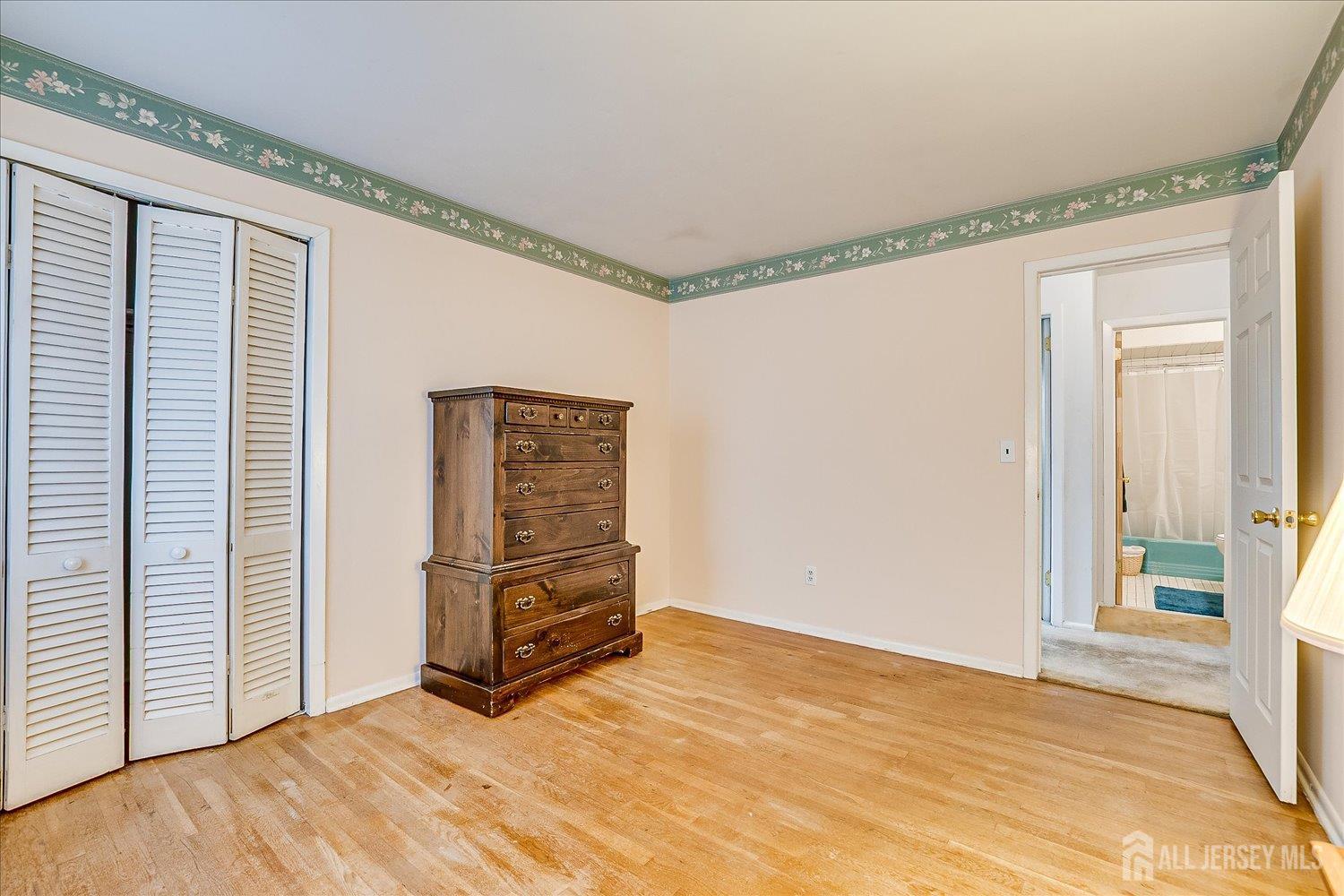 4 Bodnarik Road Edison, NJ 08837 - Photo 30 of 41 a view of an empty room with wooden floor and a window