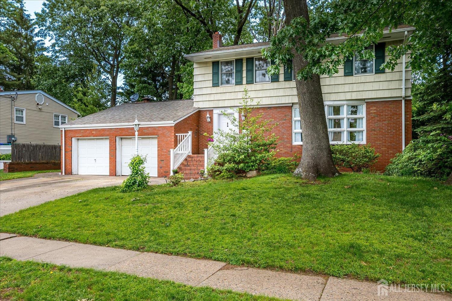 4 Bodnarik Road Edison, NJ 08837 - Photo 3 of 41 a view of a house with a yard and potted plants