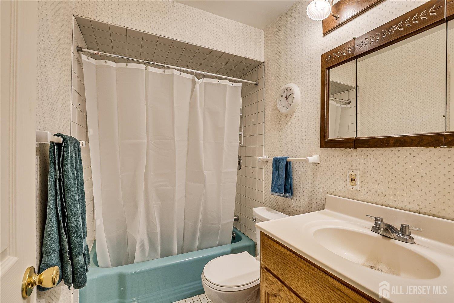 4 Bodnarik Road Edison, NJ 08837 - Photo 32 of 41 a bathroom with a sink a toilet and a mirror