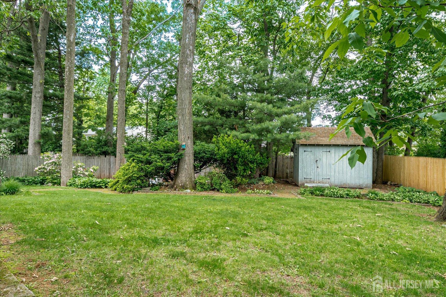 4 Bodnarik Road Edison, NJ 08837 - Photo 39 of 41 a view of a house with a yard and large trees