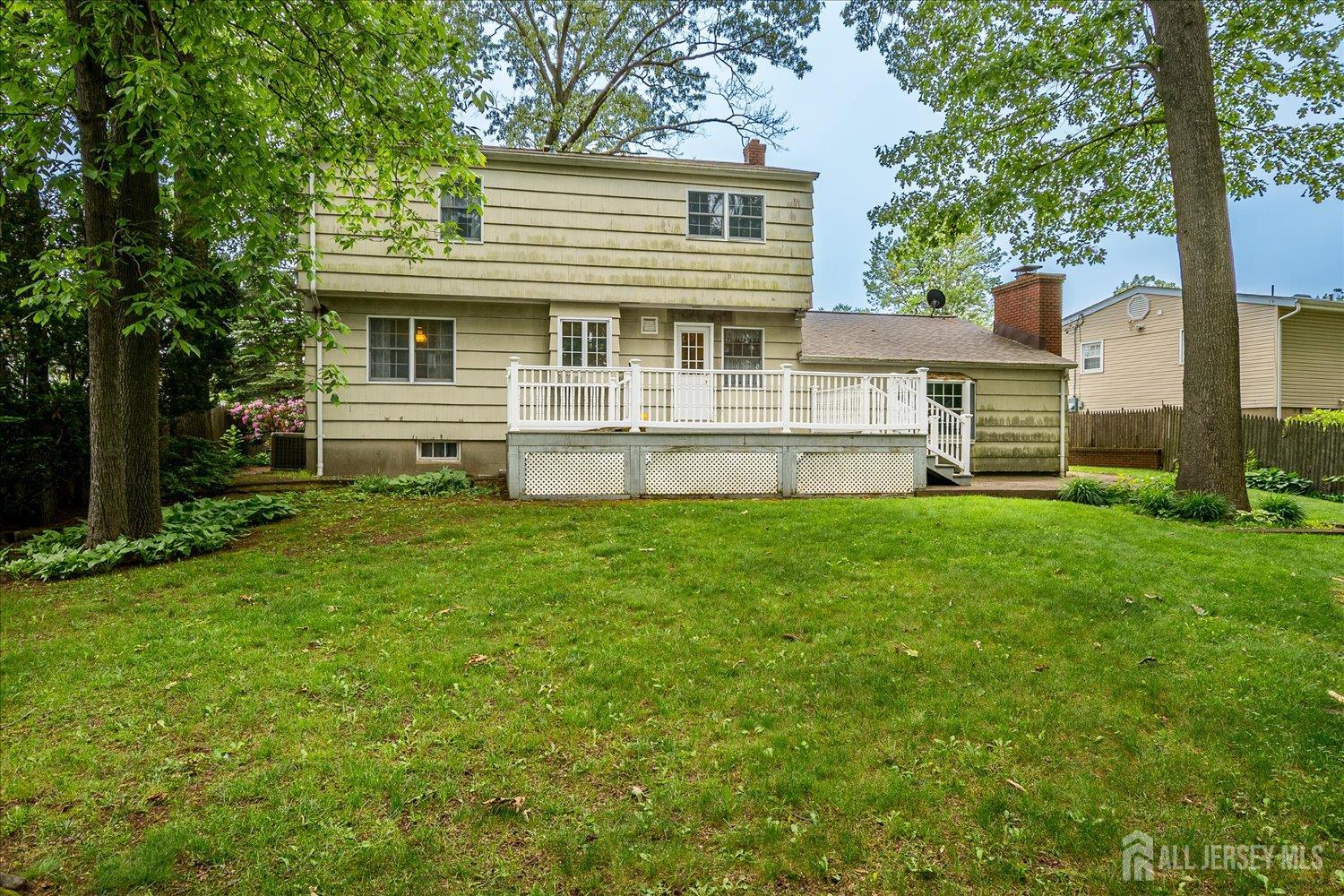 4 Bodnarik Road Edison, NJ 08837 - Photo 40 of 41 a front view of a house with a yard and a large tree
