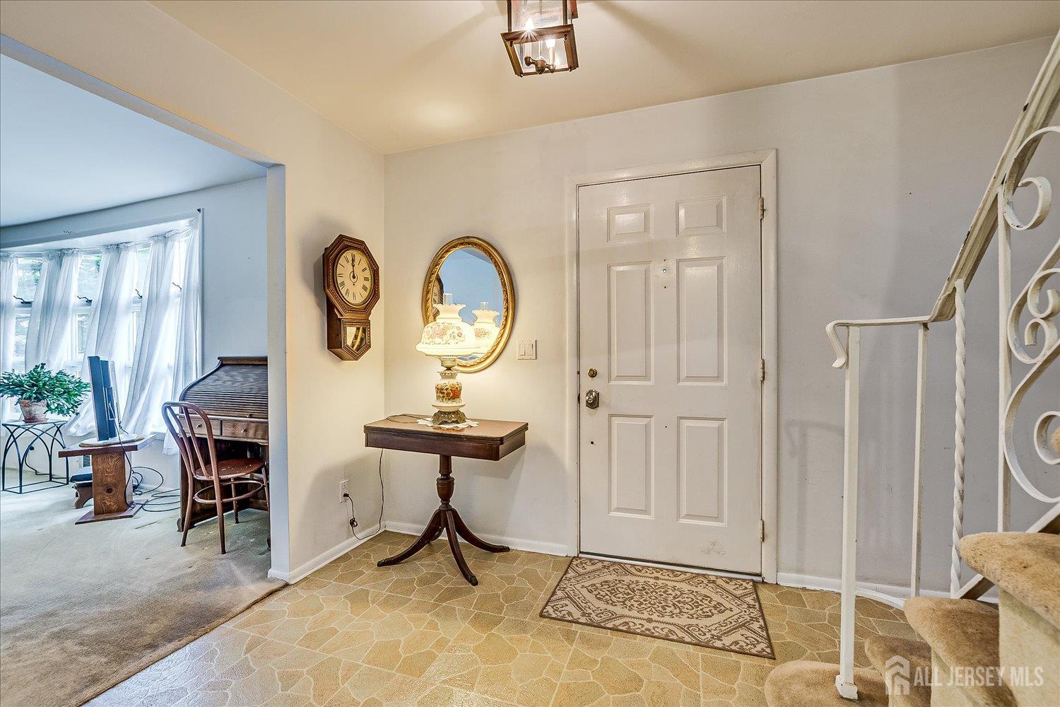 4 Bodnarik Road Edison, NJ 08837 - Photo 6 of 41 a view of a room with furniture and wooden floor