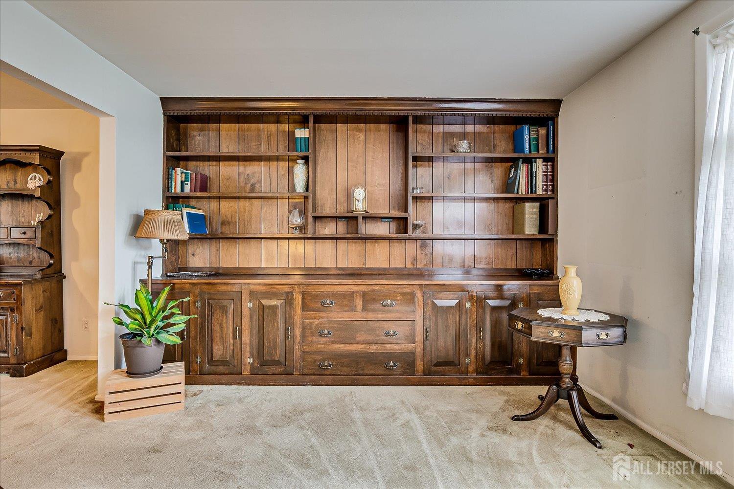 4 Bodnarik Road Edison, NJ 08837 - Photo 8 of 41 a living room with a furniture and a book shelf