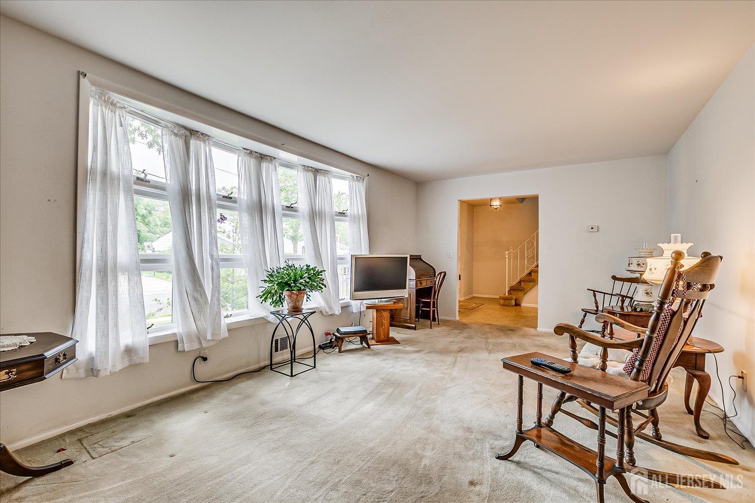 4 Bodnarik Road Edison, NJ 08837 - Photo 9 of 41 a living room with furniture and a large window