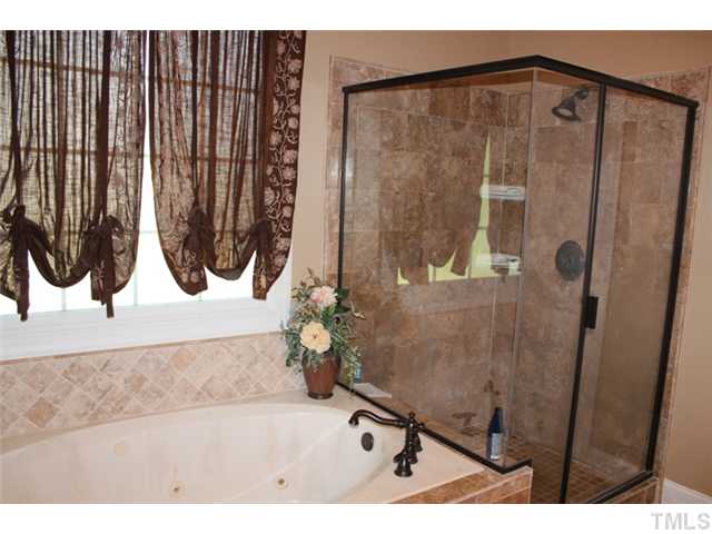 5101 Bartons Enclave Lane Raleigh, NC 27613 - Photo 15 of 25 a bathroom with a sink and a mirror