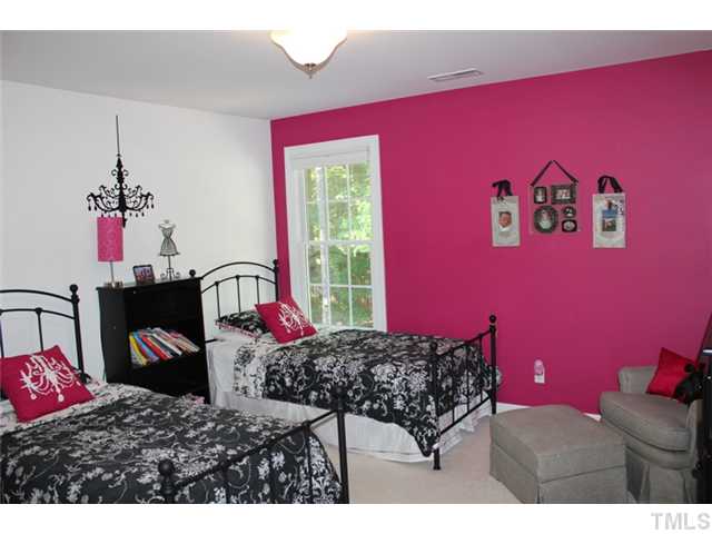 5101 Bartons Enclave Lane Raleigh, NC 27613 - Photo 16 of 25 a bedroom with a bed and a dresser