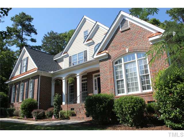 5101 Bartons Enclave Lane Raleigh, NC 27613 - Photo 2 of 25 a view of a house with brick walls and flower plants