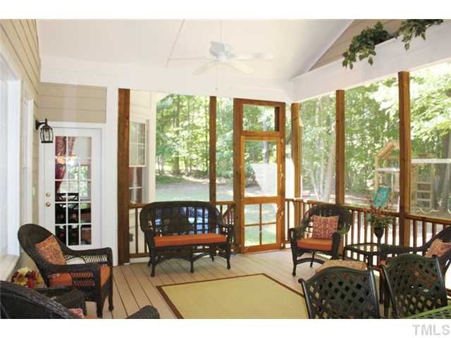 5101 Bartons Enclave Lane Raleigh, NC 27613 - Photo 21 of 25 a living room with furniture and a floor to ceiling window
