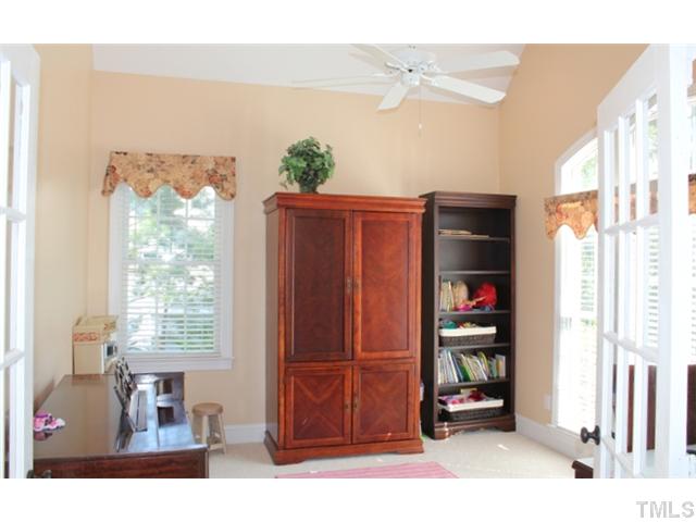 5101 Bartons Enclave Lane Raleigh, NC 27613 - Photo 4 of 25 a living room with furniture cabinets and a window