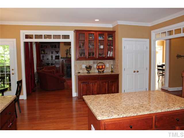5101 Bartons Enclave Lane Raleigh, NC 27613 - Photo 9 of 25 a view of kitchen island with wooden floor