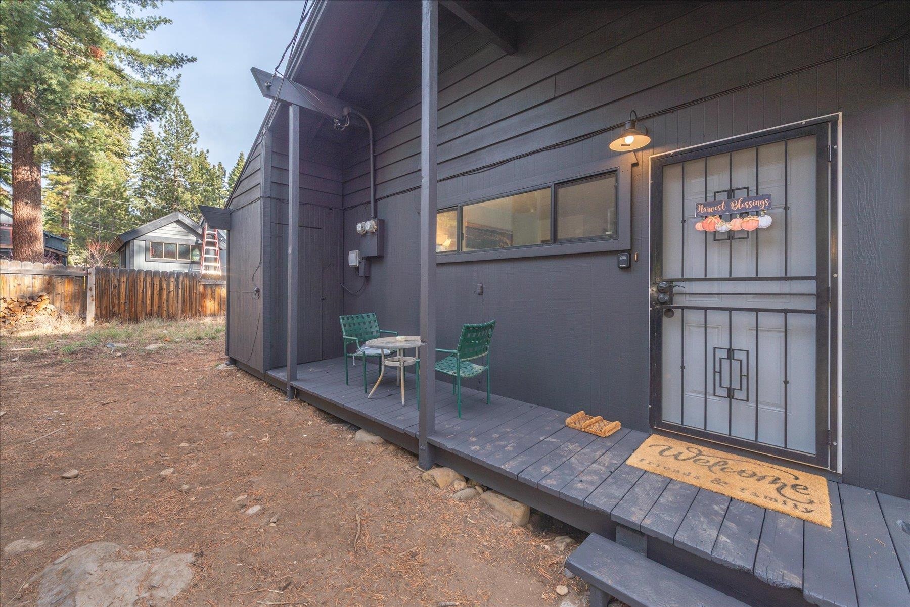 6917 Toyon Road Tahoe Vista, CA 96148 - Photo 11 of 25 a backyard of a house with table and chairs