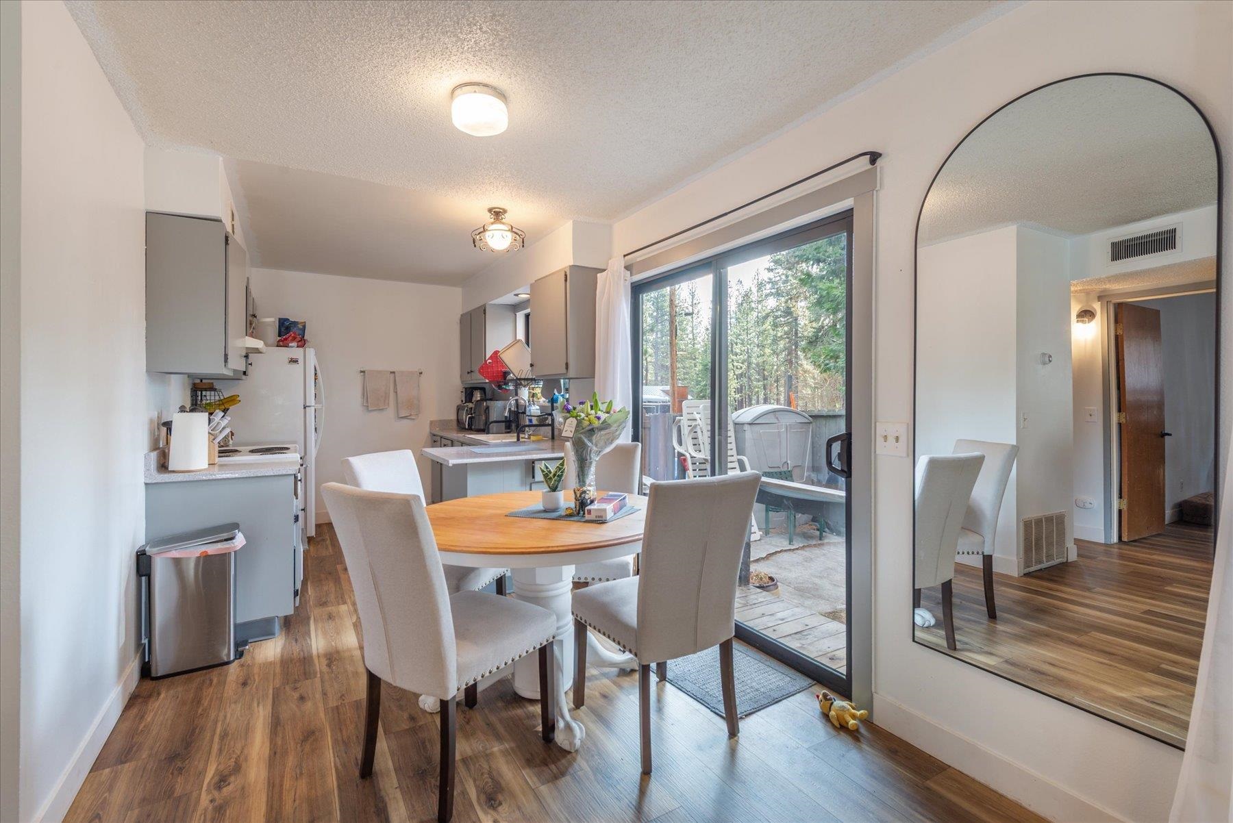 6917 Toyon Road Tahoe Vista, CA 96148 - Photo 14 of 25 a view of a dining room with furniture window and wooden floor