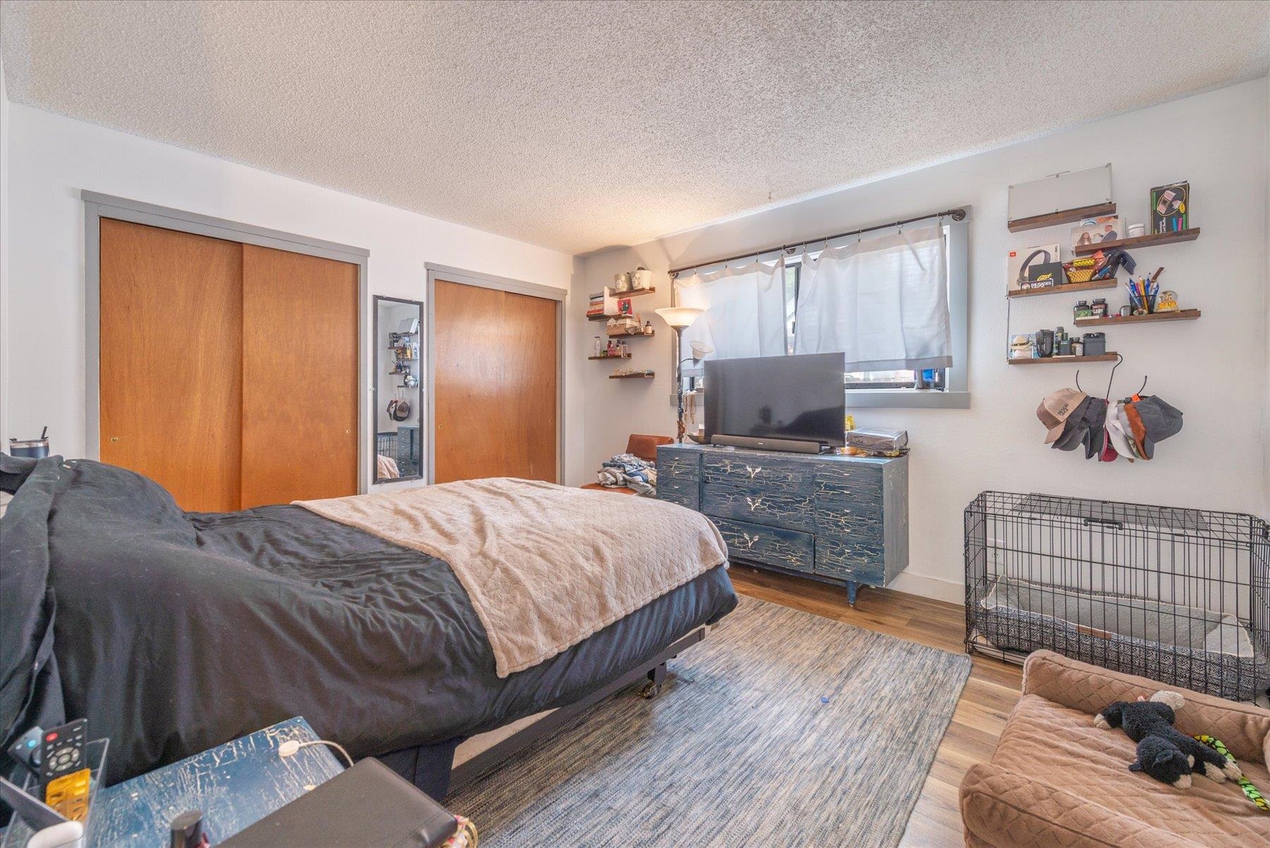 6917 Toyon Road Tahoe Vista, CA 96148 - Photo 17 of 25 a bedroom with a bed and wooden floor