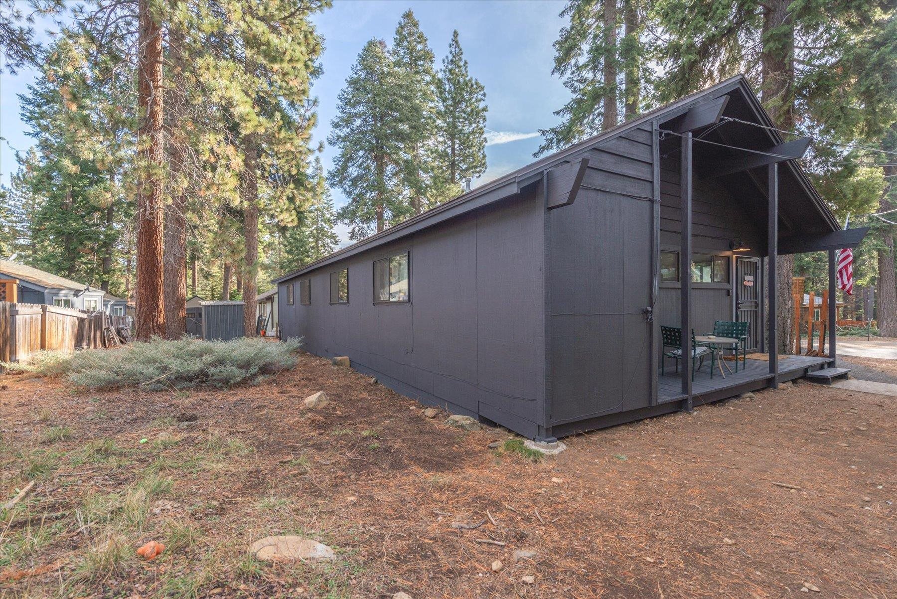 6917 Toyon Road Tahoe Vista, CA 96148 - Photo 20 of 25 a backyard of a house with lots of green space