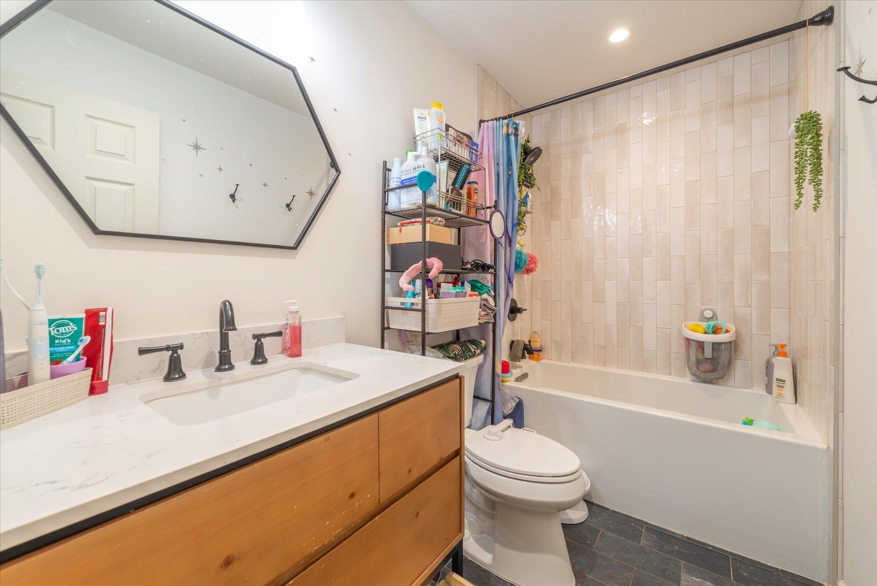 6917 Toyon Road Tahoe Vista, CA 96148 - Photo 7 of 25 a bathroom with a sink a toilet and a bathtub